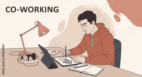 Young Man Working Remotely in Co-working Space with Tablet and Headphones