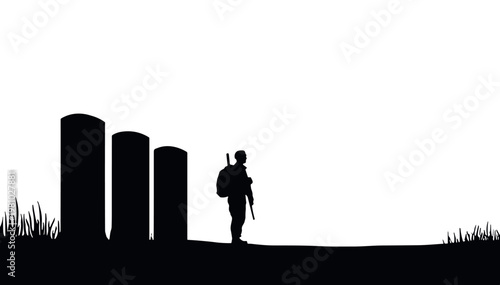 Soldier walking with a weapon silhouetted by gravestones at dusk. Victory Day  