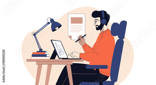 Man working on laptop and tablet with headphones, desk lamp, and books