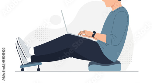 Man working on laptop with feet on footrest, comfortable home office setup