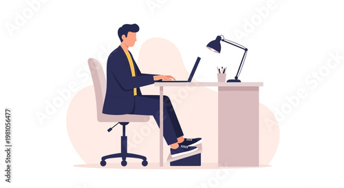 Man in suit working on laptop at desk with desk lamp, ergonomic footrest