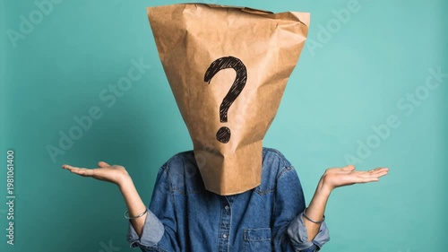 Woman wearing paper bag with question mark on head shrugging shoulders. Anonymous person making I do not know gesture. Clueless and hidden identity concept