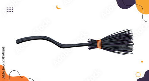 Classic witch broom with a gnarled black handle and a thick bundle of twigs tied with orange string for Halloween themed decorations.