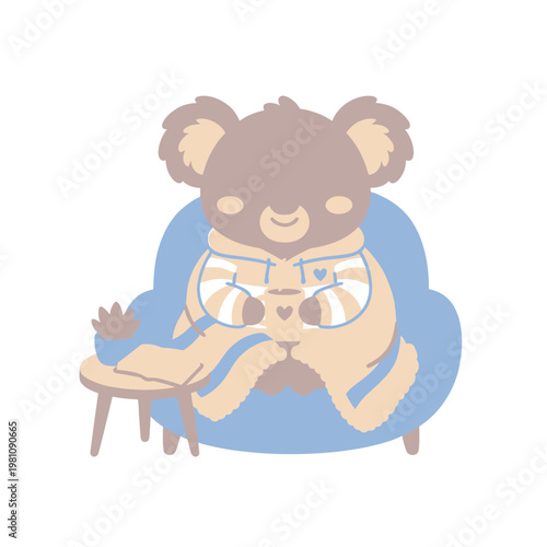 Cute koala sitting in armchair with blanket and cup of coffee