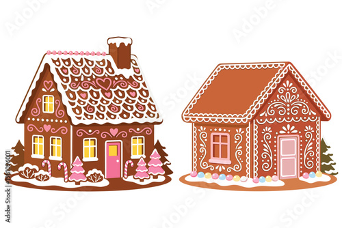 Two festive gingerbread houses decorated with white icing pink hearts and candy canes.