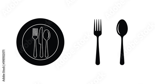 Black plate with cutlery and separate utensils a striking silhouette