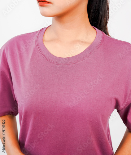 The body of a woman wearing a plain purple grape t-shirt that reveals her chest and neck, against a white background.