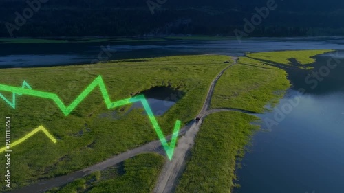 Grassy peninsula hosting forked dirt road SUV kicking dust by water, neon green graphs marking pond