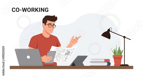 Co-working space: man working on laptop, tablet, and documents