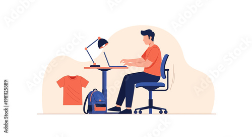 Young man working on laptop at desk, t-shirt and backpack nearby