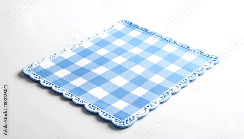 A light blue checkered tablecloth with a scalloped edge rests on a white surface.