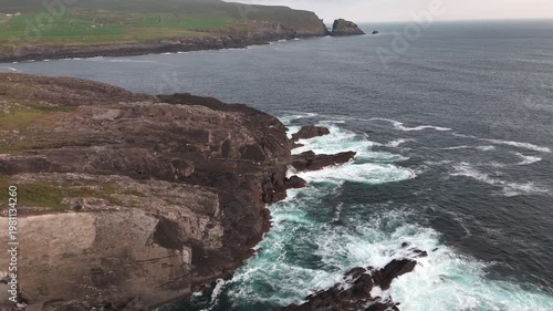 Wallpaper Mural A serene yet powerful landscape of ocean meeting rocky shores. Torontodigital.ca