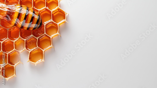 Honeycomb structure with bee on white background, showcasing natural sweetness and organic beauty