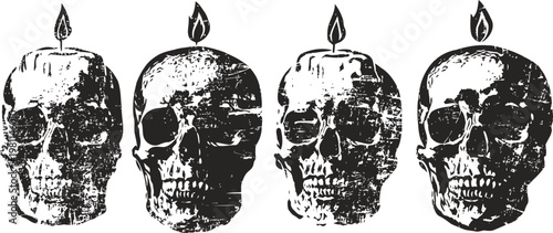 four black and white skull candles burning with detailed textured design and flickering flames