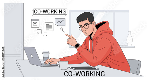 Young man working in a modern co-working space with laptop and digital tablet