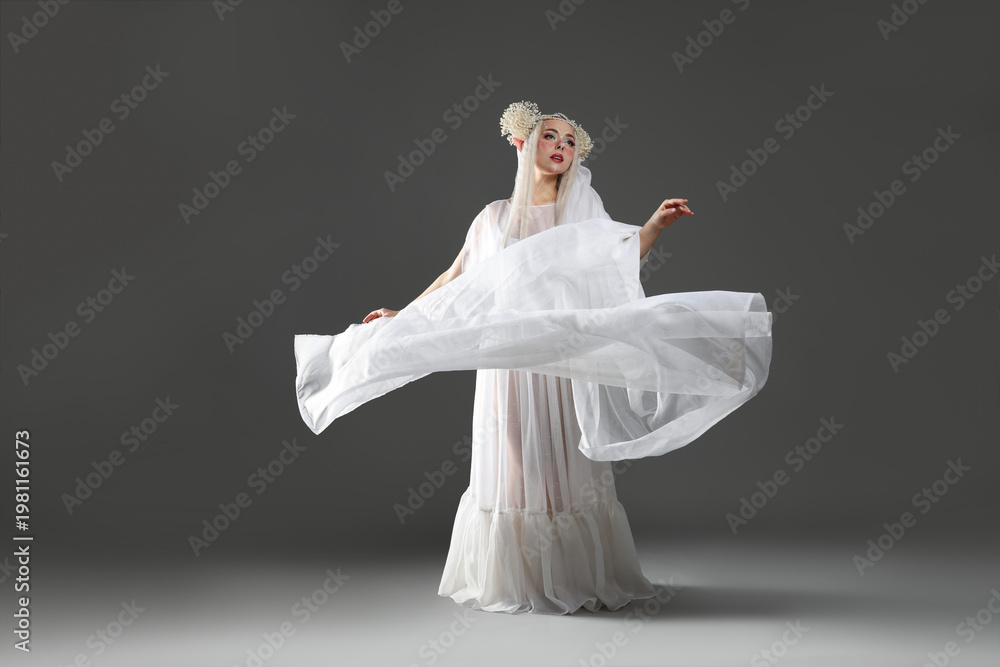 Fototapeta premium Beautiful girl dressed as elf on grey background