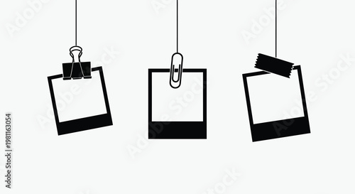 Hanging polaroid frames with clips and tape a stark silhouette