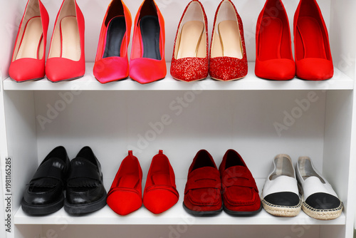 Red, black and white shoes on shelves