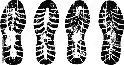four black shoe sole prints with different tread patterns on white background, dirt and wear marks