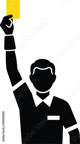 Silhouette of a soccer referee holding up a yellow card to show a warning during a match.