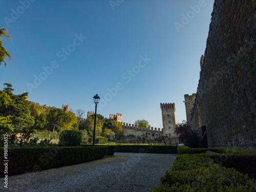 Exploring Este Castle in Padua, Italy during a clear day with a blue sky and greenery