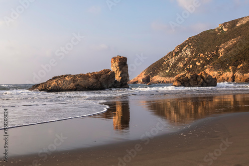 Fotografie Coastal Landscape with Sea Stacks and Sandy Beach
