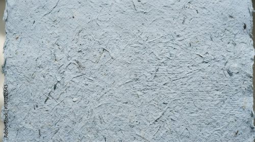 Close-up of textured gray paper with visible fibers, perfect for crafting and artistic projects