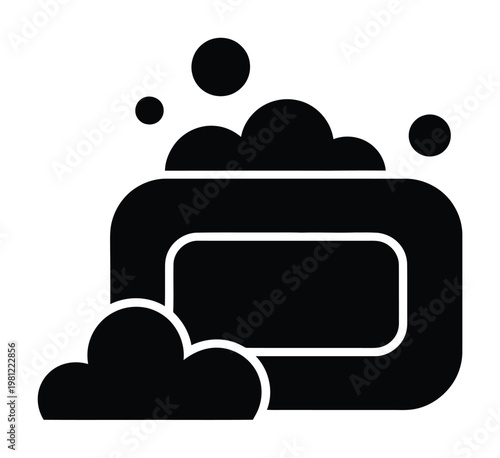 Black and white of a bar of soap with bubbles and suds