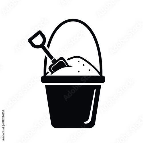 A simple black and white illustration depicts a plastic bucket filled with sand and a small shovel resting on top