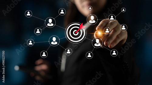 Cuadro en lienzo A business professional uses digital technology to interact with a virtual network, showcasing modern marketing strategies and client engagement initiatives for growth