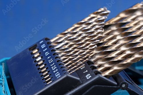 A set of drills for drilling metal in a plastic case.