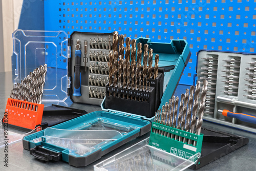 A set of drills for drilling metal in a plastic case.