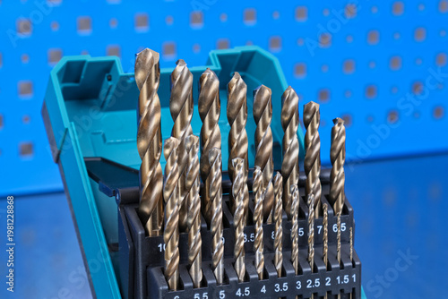 A set of drills for drilling metal in a plastic case.