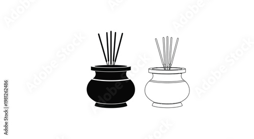 Two incense burners one dark and one light in a striking silhouette