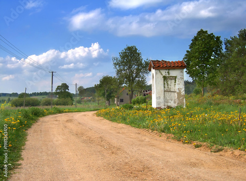 Fotografi A white roadside chapel in Masuria, Poland