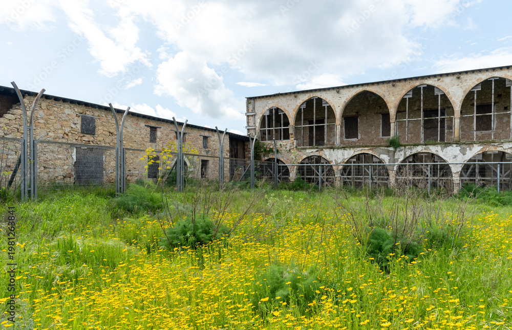 Fototapeta premium Saint panteleimon monastery, a historic religious building in cyprus, stands abandoned, showing decay with its bell tower. Northern Cyprus abandon orthodox christian church