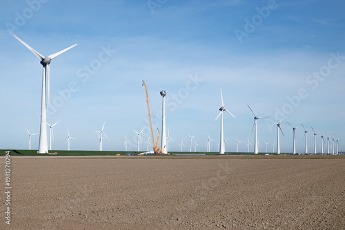 Wind turbine installation in polder landscape Netherlands