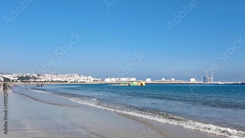 Tangier Beach Morocco with Ocean Waves and City Coastline Summer Lifestyle Pan Scene