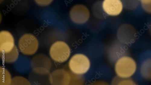 Soft Defocused Glitter Light Background In Blue, Gold, And Black. Abstract Luminous Blue And Gold Elements With Dark Contrast, Creating A Reflective Atmosphere