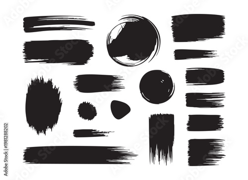 Assortment of black brush strokes and shapes on white, irregular paint textures