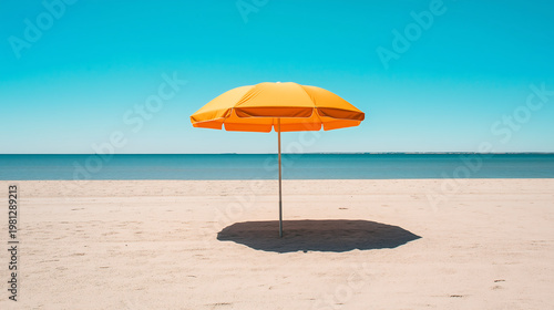 Colorful beach umbrella on sandy beach, copy space