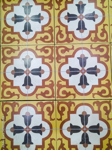 High-angle shot of a patchwork arrangement of decorative ceramic tiles