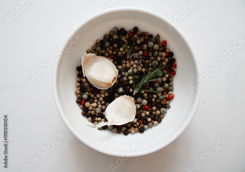 Minimal healthy food composition with garlic cloves and spice mix, ideal for dietetics, nutrition guides and organic product marketing