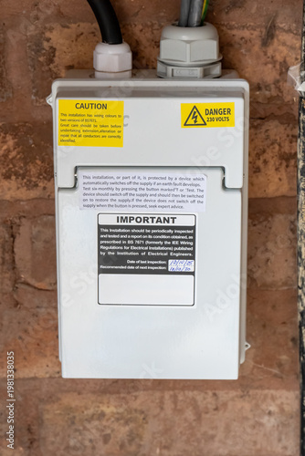 Electrical Safety Inspection Label and Danger Warning on Domestic Fuse Box
