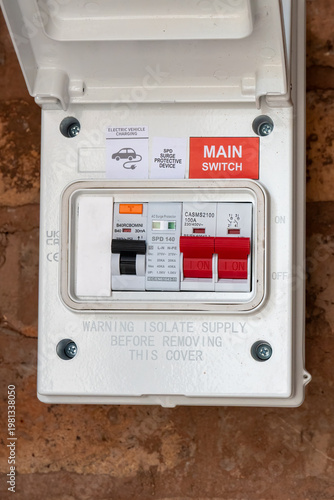 Residential EV Charging Circuit Breaker Box with Surge Protection on brick Wall