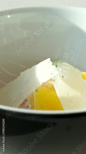 Mac and cheese pasta. American style Italian pasta with cheddar cheese on a white plate. Food video