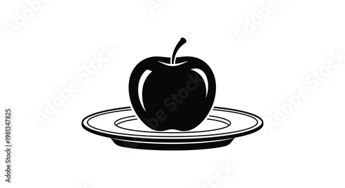 A black apple rests on a plate a striking silhouette