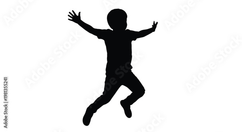 A silhouette of a young boy mid jump arms outstretched conveying a sense of joy and freedom