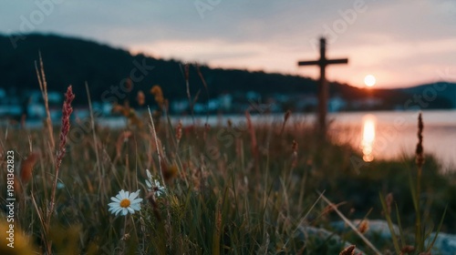 Peaceful watercolor landscape with a soft pastel rose and gold sky, the simple dark silhouette of Jesus Christ's cross resting on a gently rolling distant hill, viewed through a soft-focus foreground