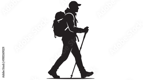 Silhouette of hiker with backpack and trekking poles walking at dusk outdoor adventure concept